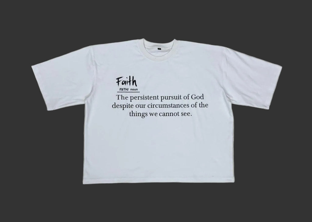 White t shirt explaining the definition of faith. Faith is pursuing God and trusting he is in control of the things we cannot see. 